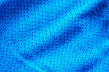 Blue fabric sport clothing football jersey with air mesh texture background