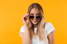 Portrait Of A Smiling Young Blonde Girl In Sunglasses