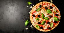Traditional Italian Pizza On Dark Table