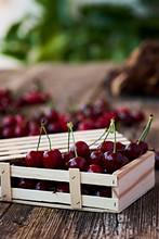 Wooden Box With Delicious Ripe Cherry