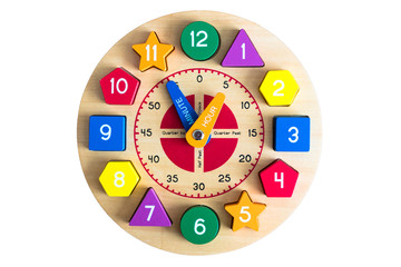 Wooden toy clock on a white background, isolated