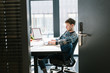 © Alvaro Hernandez/ADDICTIVE STOCK - Man working on laptop in office