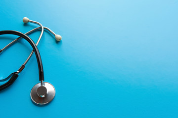 Stethoscope on a blue background, the tool of the doctor. The concept of medicine.