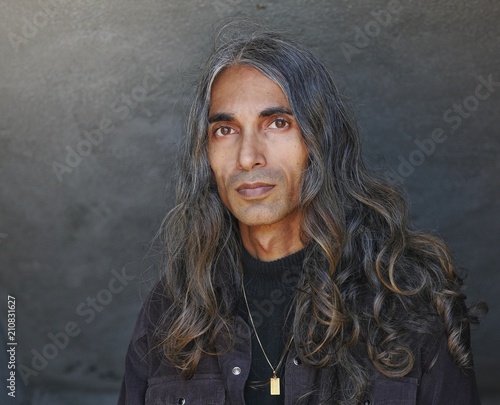Long Haired Man In Black Dress Shirt Buy This Stock Photo And