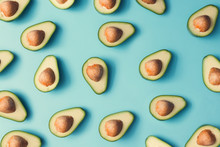 Avocado Colorful Pattern On A Pastel Blue Background. Summer Concept. Flat Lay.