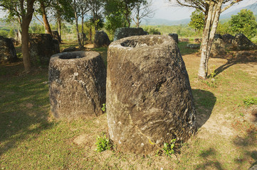 Ancient stone jars in a Plain of Jars (Site #3) near Phonsavan,  Xienghouang province, Laos. UNESCO World Heritage Site..