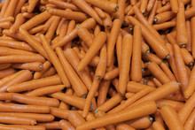 A Mass Of Orange Carrots At The Markets