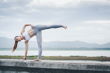 Asia woman doing yoga fitness exercise