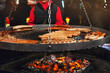 Grilling typical German sausages in a market stall.