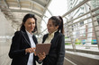© Blanscape - Two business women with tablet in city