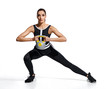© Romario Ien - Athletic woman training muscles of hands and legs using a kettlebell. Photo of woman in black sportswear isolated on white background. Strength and motivation