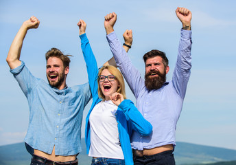 Wall Mural - Freedom concept. Employees enjoy feeling of freedom. Company three happy colleagues office workers enjoy freedom, sky background. Men with beard in formal wear and blonde in eyeglasses finished work