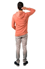 Full body of  Man in a pink sweatshirt looking back on isolated white background. Ideal for use in architectural designs