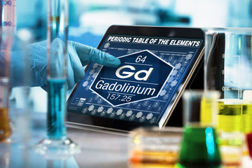 Canvas Print - researcher working on the digital tablet data of the chemical element Gadolinium Gd / researcher working on the computer with the periodic table of elements 