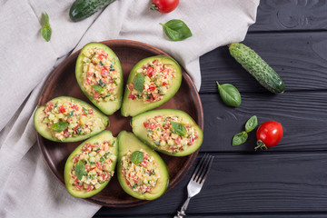 Wall Mural - Avocado stuffed with cucumber , tomatoes and eggs