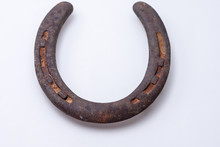 Old Vintage Rusty Horseshoe On White Background With Room For Text