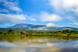 © ramdannain - Serene morning view of the Mount Kinabalu and rainforest hills. Beautiful reflection on a recreational fishing pond in Ranau, Sabah, Malaysia.