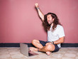 © marc - Young man with long hair working with his laptop