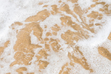 HDR shot of sea shore with wave and white sand during summer day in thailand (selective focus and white balance / color tone shift )