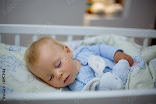 Adorable Newborn Baby Boy Sleeping In Crib At Night Little Boy