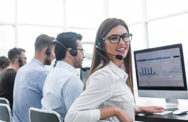 employee of the business center using the computers to analyze the data