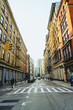 View down a street in New York City with tall buildings creating dramatic perspective