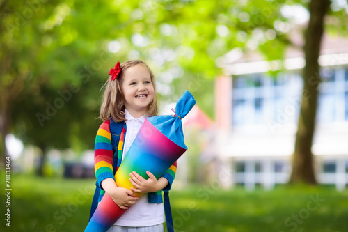 Fotografía Little child with candy cone on first school day