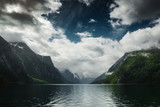 Fototapeta Góry - Picturesque landscape with mountains, cloudy sky and lovatnet lake, Sogn og Fjordane county, Norway
