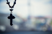 The Christian Cross Hanging With Blurred Background .