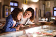© JackF - Smiling mom and daughter looking at expositions
