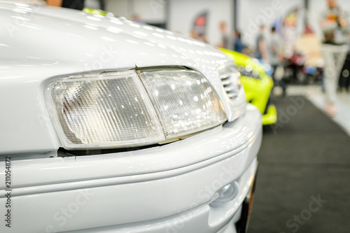 Fényképezés  white car headlight close-up