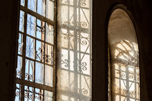 Windows In The Church With A Patterned Lattice In The Sun