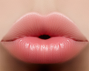 closeup kiss natural lip makeup. beautiful plump full lips on female face. clean skin, fresh make-up