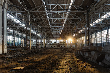  Sunlight of sunset in large abandoned industrial building of Voronezh excavator factory  