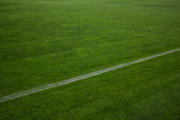 artificial small football field green grass surface background texture with nobody sport concept and empty space for copy or text