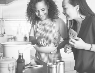 Wall Mural - Diverse women cooking in the kitchen