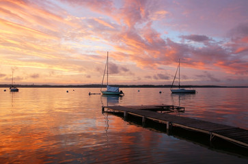 beautiful marine after sunset background.amazing summer evening landscape with group of drifting yac
