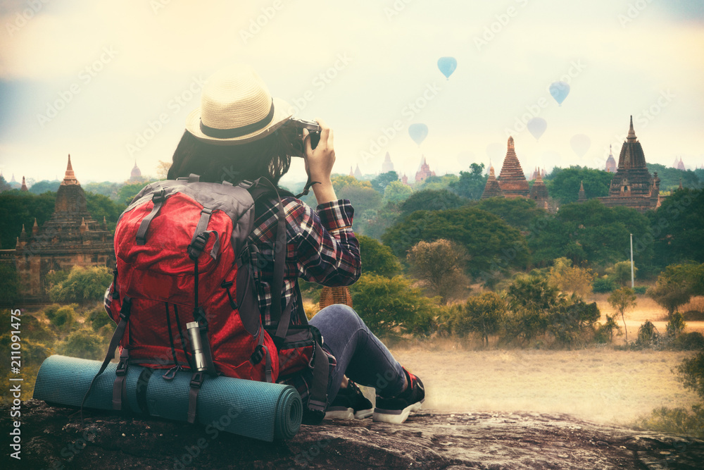 Backpacking woman traveller and photographing in Bagan Mandalay Myanmar - obrazy, fototapety, plakaty 