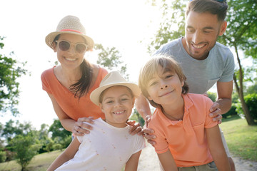 Portrait of family of 4 on vacation