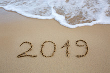 Year 2019 Written At The Caribbean Sand Beach With Sea Wave .