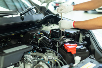 Auto mechanic working in garage, Car Repair Service center.