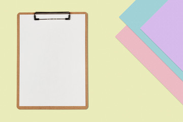 Clipboard with white sheet on pastel color background, Minimal concept