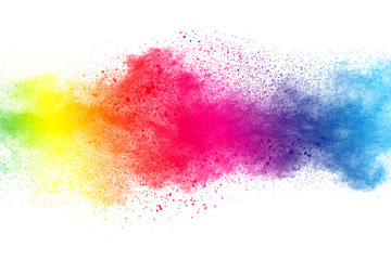 abstract multi color powder explosion on white background. freeze motion of dust particles splashing