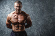 © blackday - Strong and muscular bodybuilder showing his body