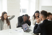 Disappointed Diverse Millennial Team Feeling Despair Because Of Bad Results Or Falling Statistics, Upset Colleagues Shocked By Negative Bankruptcy News At Company Meeting, Trying To Solve Problems.