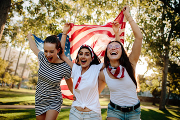 Enthusiastic American girls celebrating independence day