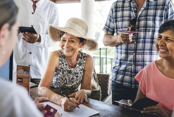 guests checking in to a hotel