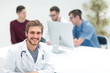 © ASDF - doctor looking at camera and smiling