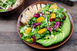 green salad with avocado, chicken and citrus