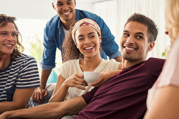 Happy young friends at home